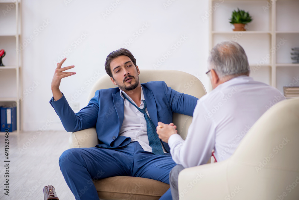 Young businessman employee visiting psychologist