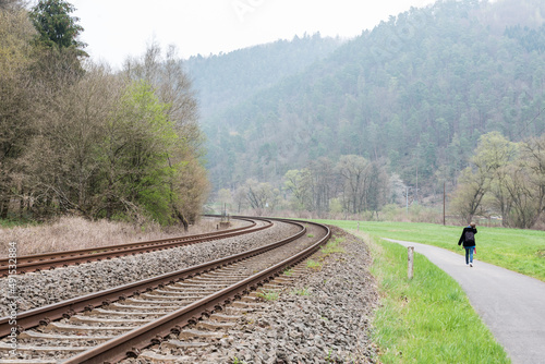 Kordel, Rhineland-Palatinate - Germany -  Double bending railwaytrack in the foggy nature landscape along the Kyll creek valley photo