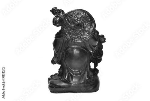 Laughing buddha statue isolated on black