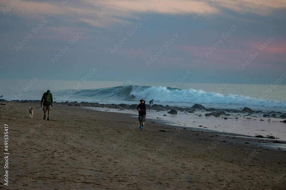 Surfing Rincon point on a big winter swell at sunset