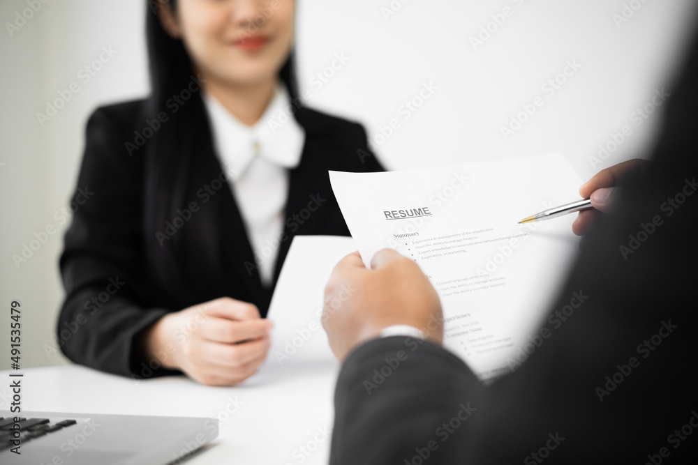 Business woman to greet a HR staff before a job interview to apply for a job. Happy woman seeker or insurance broker presenting a business deal. Smart asian woman sending resume. Business woman to greet a HR staff before a job interview to apply for a job. Happy woman seeker or insurance broker presenting a business deal. Smart asian woman sending resume.