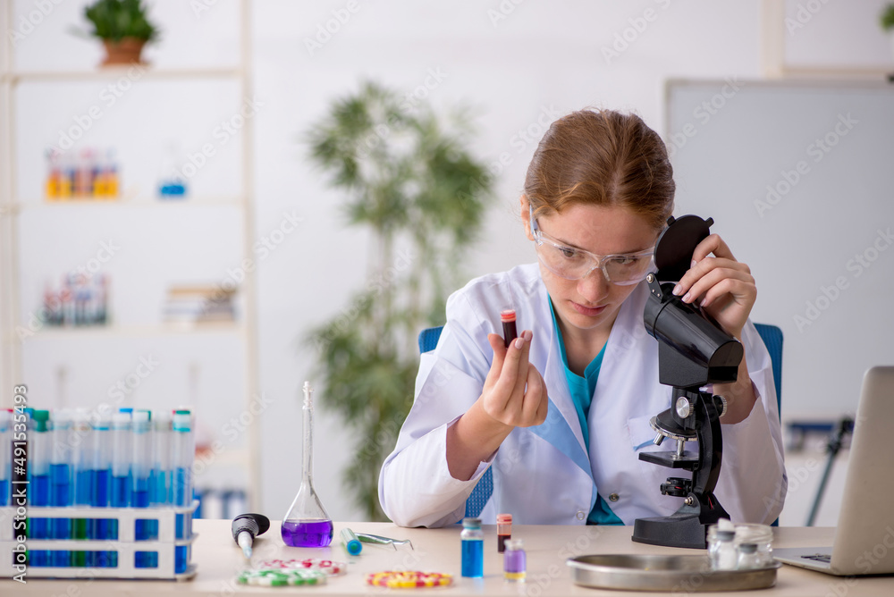 Young female chemist in drugs synthesis concept Young female chemist in drugs synthesis concept