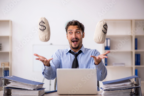 Young male employee in remuneration concept
