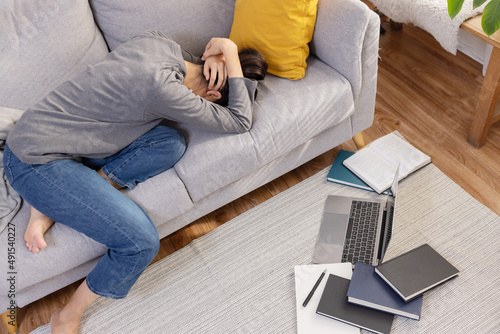 Asian Woman Rest on the Couch Suffer From Burnout Syndrome