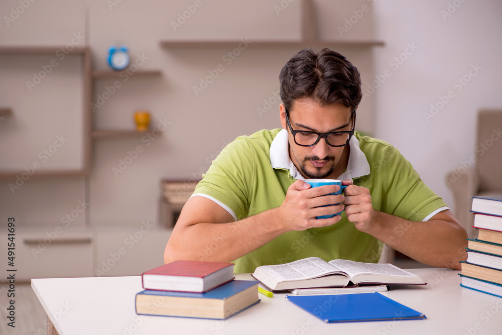 Young male student studying at home Young male student studying at home