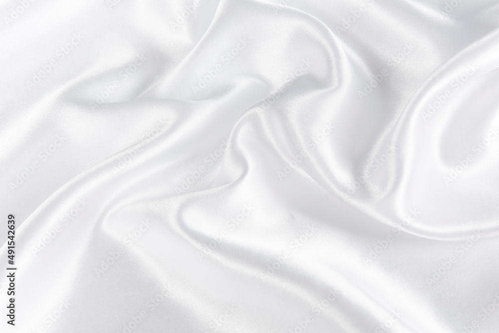 Abstract white silk fabric texture background. Creases of satin Abstract white silk fabric texture background. Creases of satin