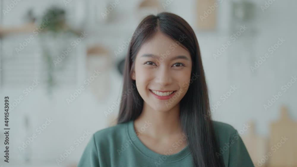 Portrait smiling asian young woman looking to camera. Facial expression happy Portrait smiling asian young woman looking to camera. Facial expression happy