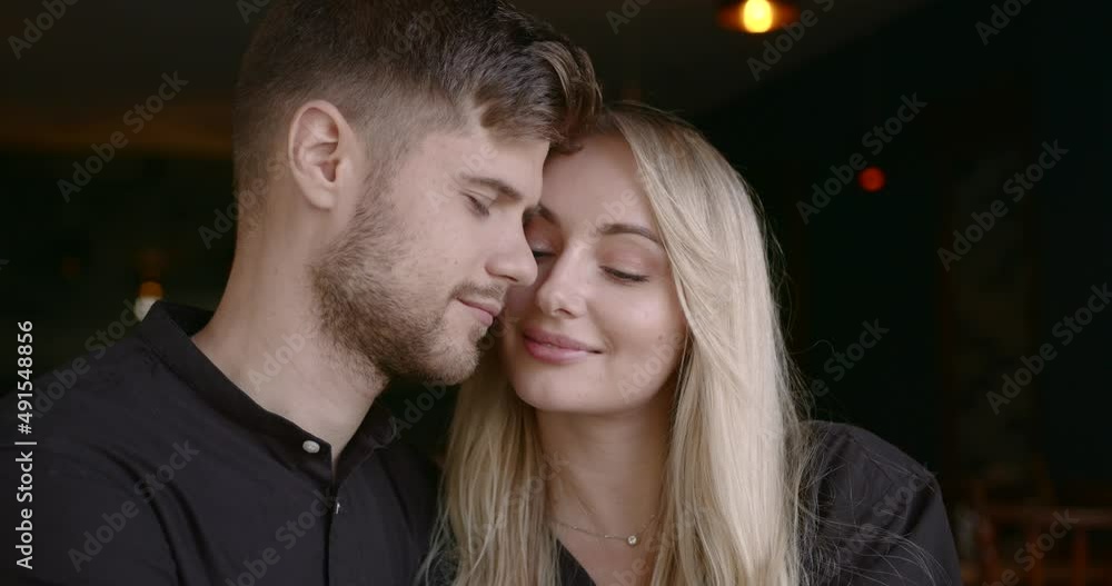 Beautiful people man and woman hugging at restaurant Beautiful people man and woman hugging at restaurant