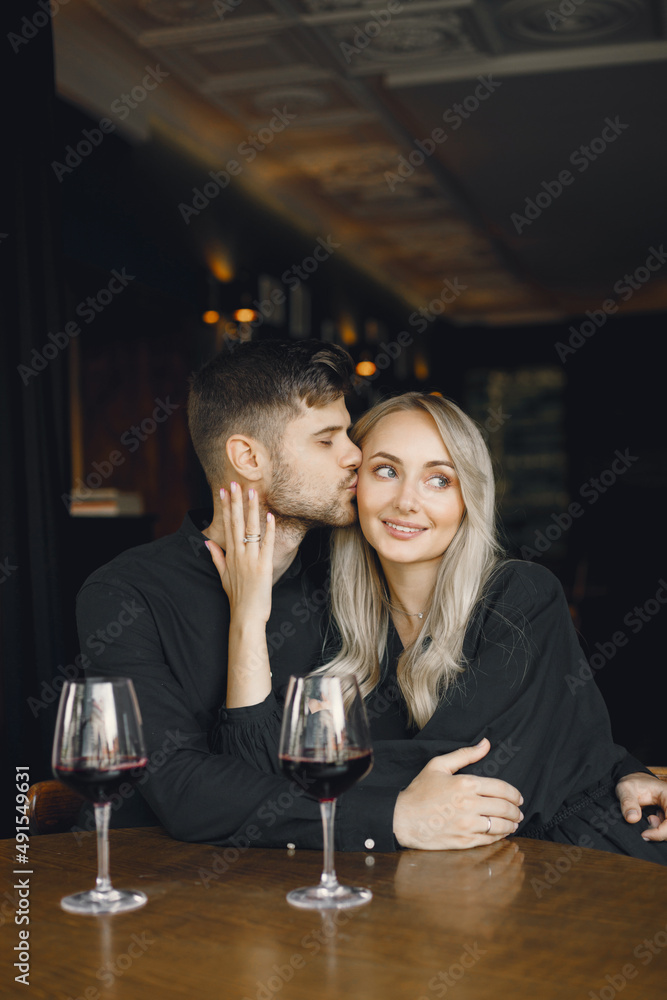 Couple hugging and have wine in cafe Couple hugging and have wine in cafe