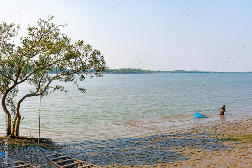 Satkhira, Bangladesh - 29 January 2017 - Poor Women Fishing with Hand Net, on the Bank of a River
