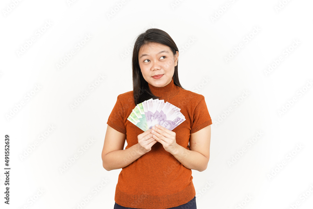 Holding Ten Thousand and Twenty Thousand Indonesian Rupiah Banknote Of Beautiful Asian Woman Holding Ten Thousand and Twenty Thousand Indonesian Rupiah Banknote Of Beautiful Asian Woman