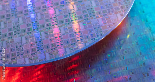 Macro of silicon wafer semiconductor with neon color, integrated circuits to manufacture CPU and GPU