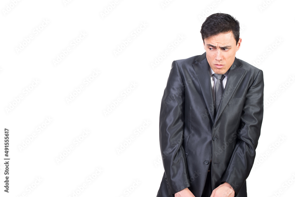 Scared shy man looking away in white studio Scared shy man looking away in white studio
