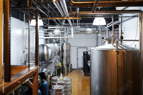 Equipment for the production of craft beer, containers for fermentation in the climatic chamber, pressure gauge with tubes and stainless steel tanks.