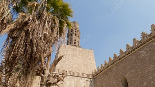 Al-Hakim Mosque with magnificent minaret, Islamic Cairo, Egypt. Locked off lookup up shot photo
