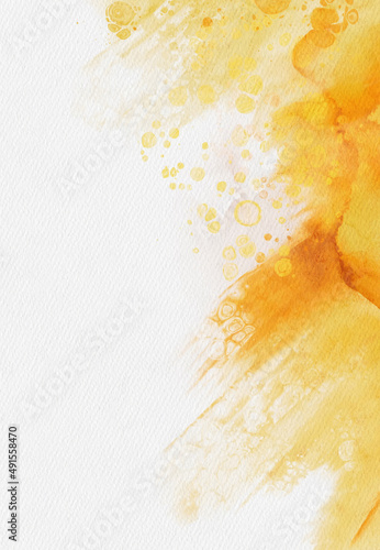 Abstract gold and yellow watercolor paint background.