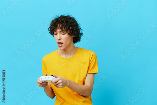 guy plays games gamepad Lifestyle entertainment blue background
