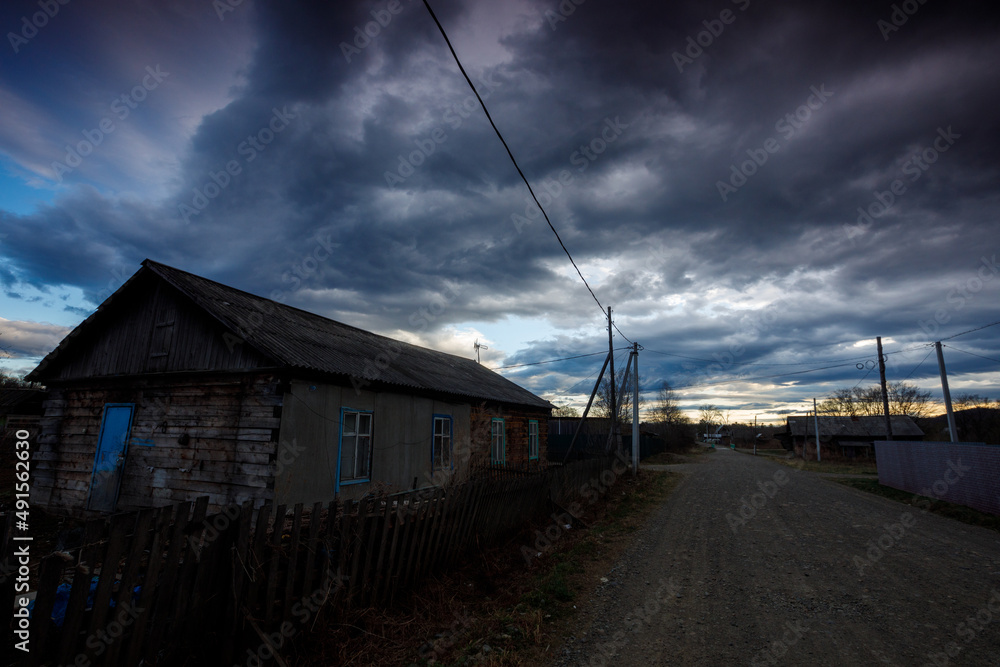 The village of Krasny Yar in Primorsky Krai. Street in a Russian village during bad weather. Storm warning in the village. The village of Krasny Yar in Primorsky Krai. Street in a Russian village during bad weather. Storm warning in the village.