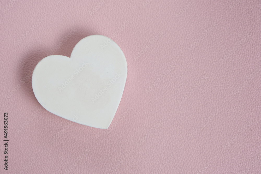 White heart pink background.Festive background for Valentines Day. White heart pink background.Festive background for Valentines Day.