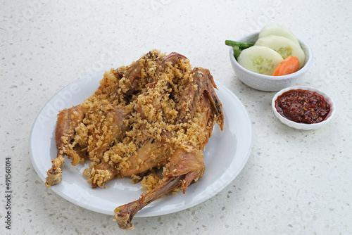 Ayam Goreng Kremes, Indonesian cuisine, fried chicken that cooked with special spice, combined with crispy fried flour (kremes).
 photo