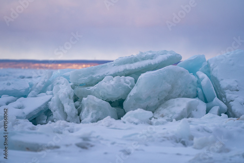 Blue Ice Chunks on Lake Michigan - Frozen Lake with snow, beautiful colorful sky, and clouds in the background