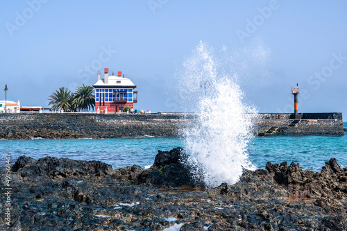 Arrieta, Casa Juanita, The Blue House with water outlet between the rocks photo