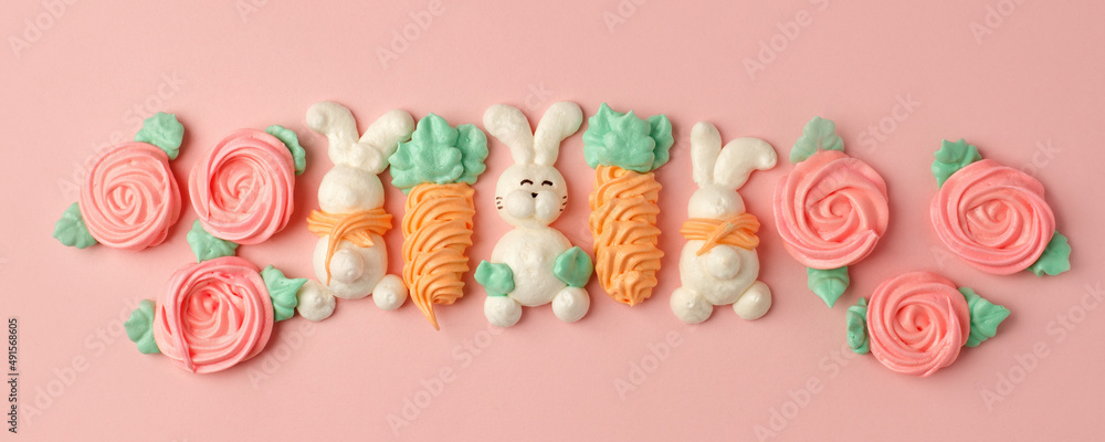 Sweets, pastry, gingerbread cookies for Easter table. Easter cute rabbit bunny, carrot on pink background top view copy space, spring seasonal holiday banner for your site, flyer, coupon