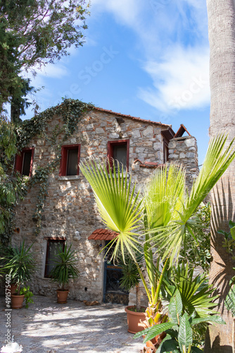 Traditional, old stone house with green plants in Old Datca, Turkey. No people. photo