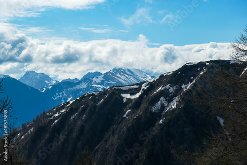 Panoramic view near Frauenkogel on the mountain peaks in the Karawanks, Carinthia, Austria. Borders Austria, Slovenia, Italy. Triglav National Park. Looking on mount Hochstuhl (Stol). Forest valley