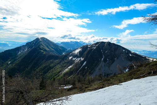Panoramic view near Frauenkogel on the mountain peaks in the Karawanks, Carinthia, Austria. Borders Austria, Slovenia, Italy. Triglav National Park. Looking on mount Kahlkogel (Golica). Forest valley © Chris