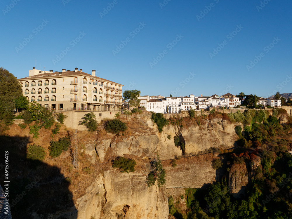Amazing village of Ronda. White villages in the province of Malaga, Andalusia, Spain. Beautiful village on the cliff of the mountain. Touristic destination. Holidays and enjoy the sun. 
