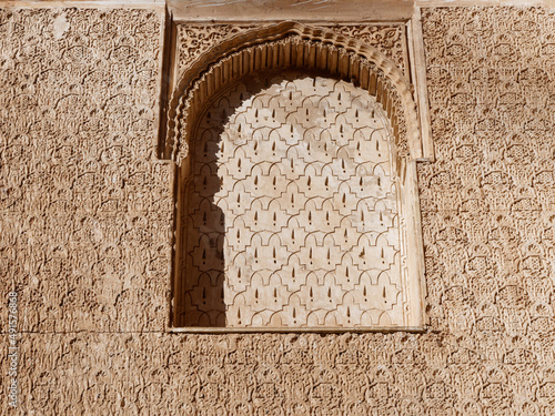 Close up detail of filigree walls, arches. Detailed handcraft of Moorish Architecture. Travel in time and discover history. Historic destination. Beautiful background and textures. 
