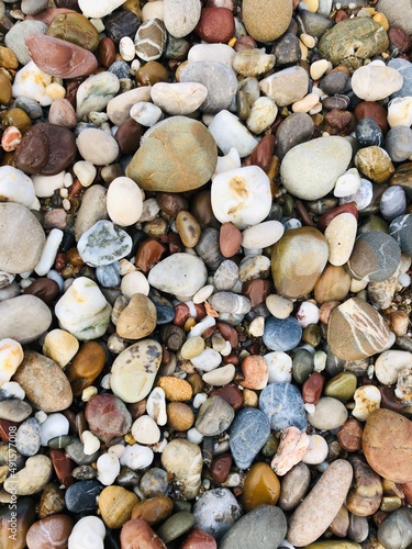 Stones at the sea shore. Close up view of stony beach at family vacation