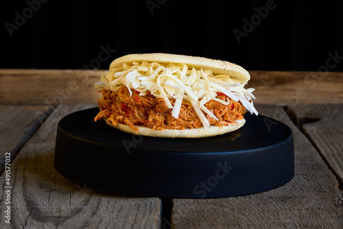 arepa stuffed with cheese and shredded chicken