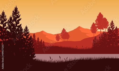 Adorable mountain view of the countryside with silhouettes of pine trees around the sea © City