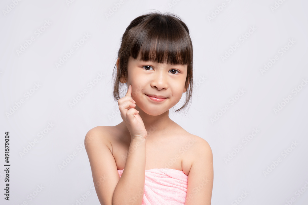 Asian young girl bright face on white background, Skin care beauty treatments concept. White model with clean, health skin of face. Children's products Asian young girl bright face on white background, Skin care beauty treatments concept. White model with clean, health skin of face. Children's products