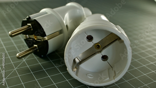 male and female power plug. Wireless plug end. Grounded plug.