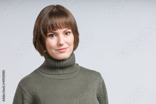 portrait of a young woman with open minded look