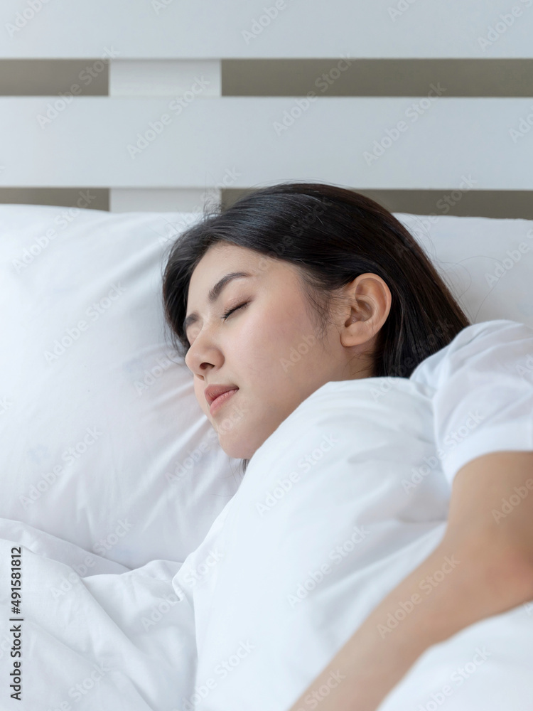 Young beautiful woman sleeping on the bed Young beautiful woman sleeping on the bed