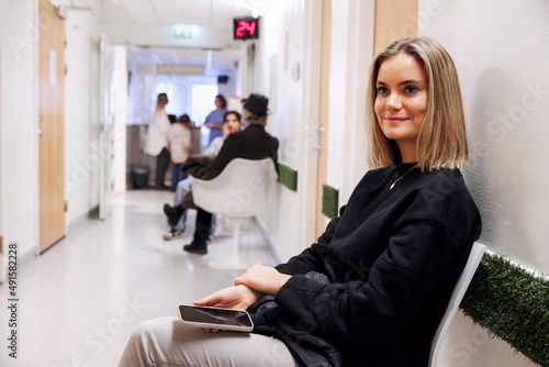 Young female patient waiting in outpatient clinic