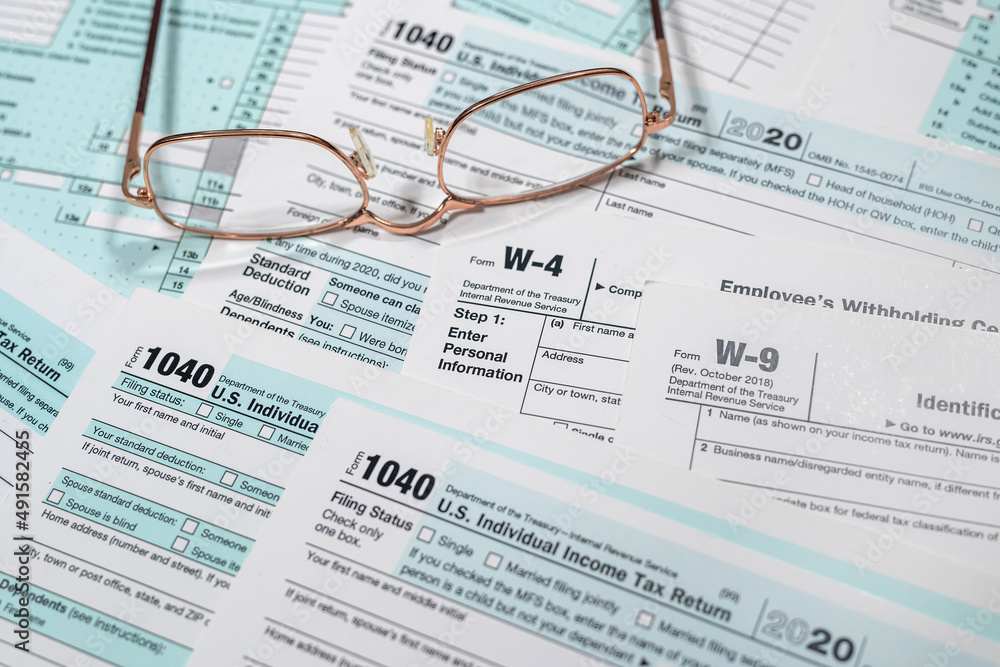 1040 US individual income tax form with glasses 1040 US individual income tax form with glasses