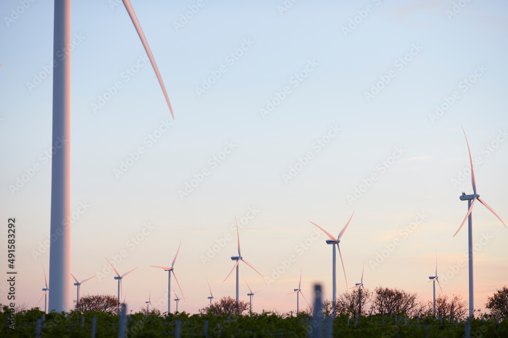 View of wind turbines at sunset View of wind turbines at sunset