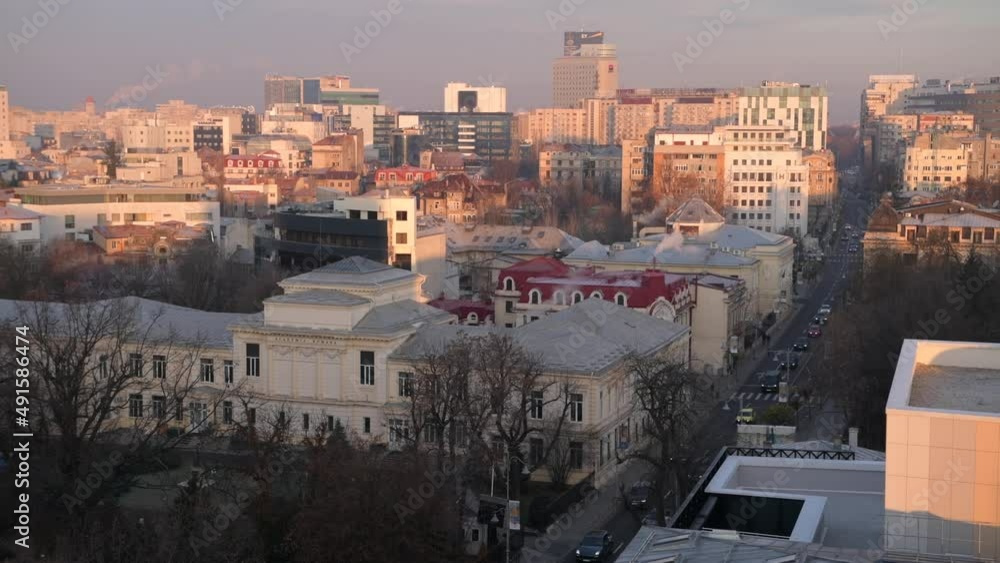 Bucharest from above during a winter sunrise. 4k video with the main landmarks from Calea Victoriei in Bucharest, Romania, filmed in the morning. Bucharest from above during a winter sunrise. 4k video with the main landmarks from Calea Victoriei in Bucharest, Romania, filmed in the morning.