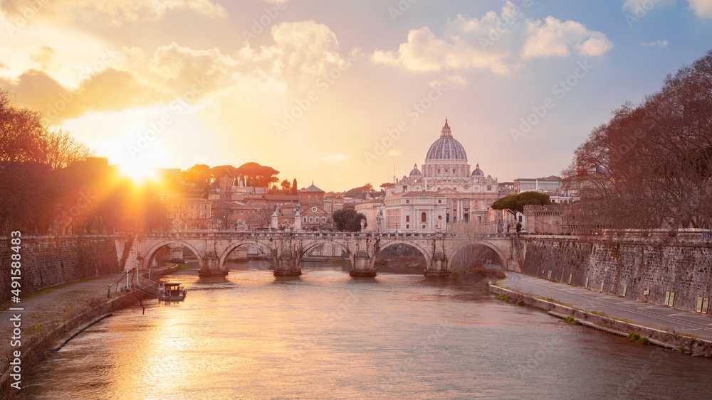 Rome, Italy. Cityscape image of Rome, Italy with the Holy Angel Bridge and St. Peter's Basilica, Vatican at sunset.