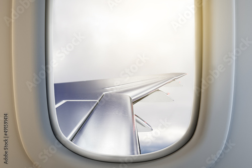 Airplane illuminator wing view on gloomy sky background with mock up place. Trip and flight concept. 3D Rendering.