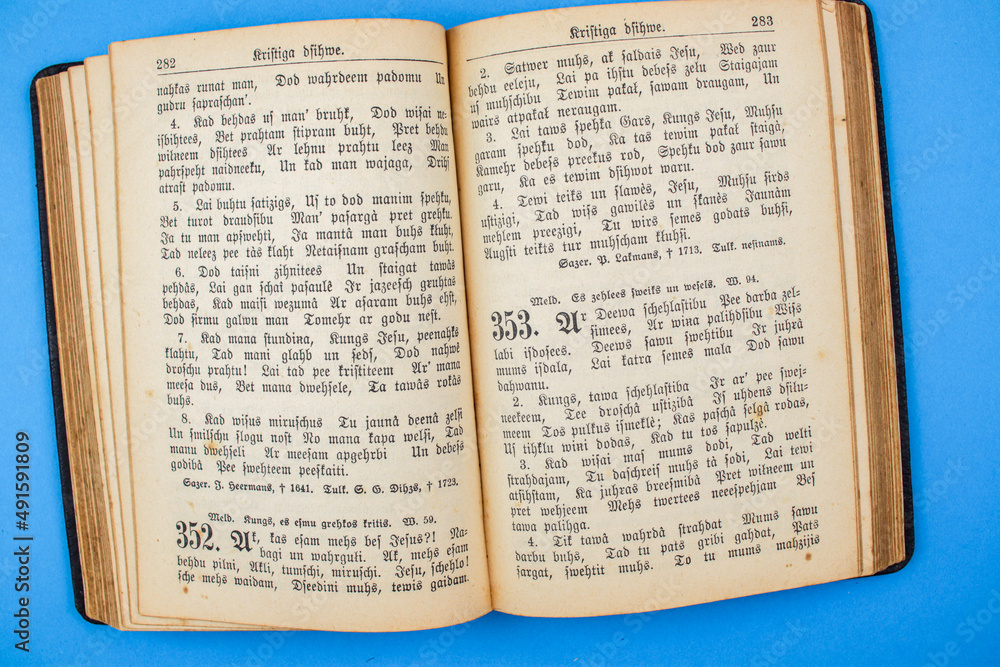 Fototapeta premium Old, Vintage Bible book on blue background