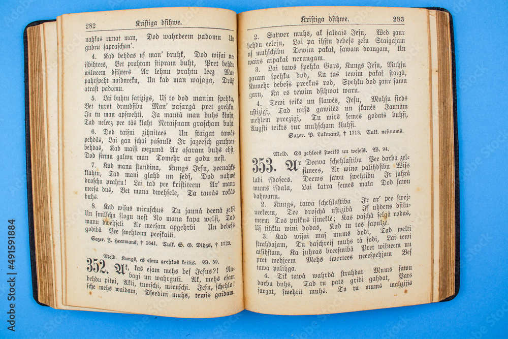 Fototapeta premium Old, Vintage Bible book on blue background