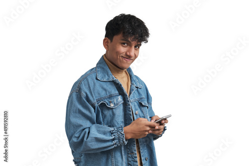 Young peruvian man using smartphone and looking at camera. Isolated over white background. photo