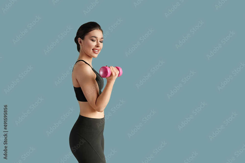 Sport fitness, and healthy lifestyle concept - smiling young woman with dumbbells exercising at home Sport fitness, and healthy lifestyle concept - smiling young woman with dumbbells exercising at home