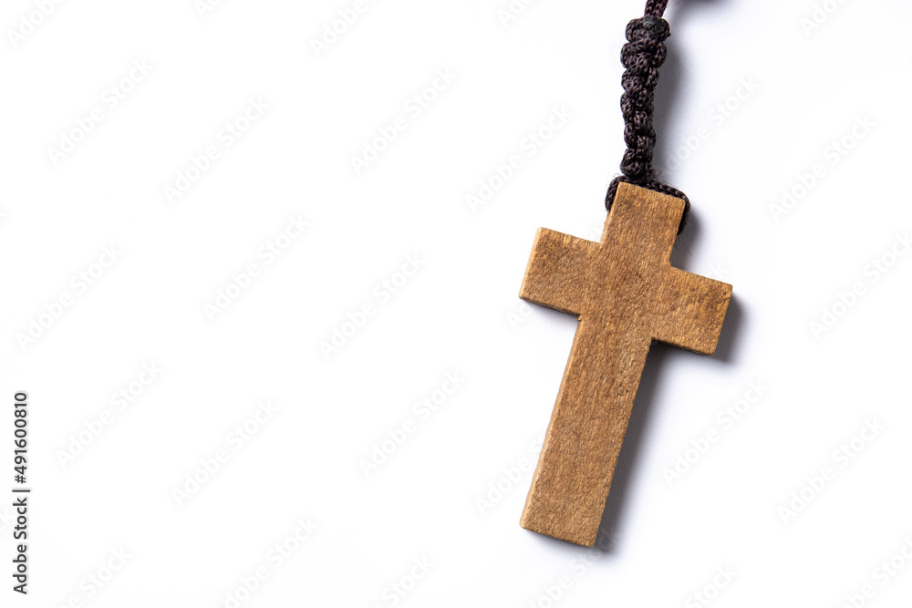 Rosary catholic cross isolated on white background. Copy space